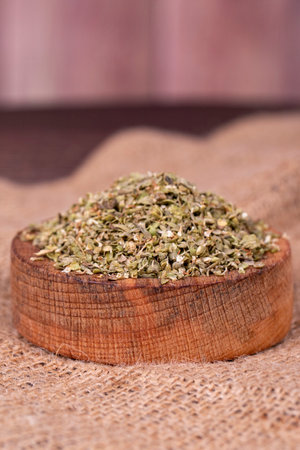Thyme spice. Dried Thyme leaf in bowl on wood background. Spice concept. close upの写真素材