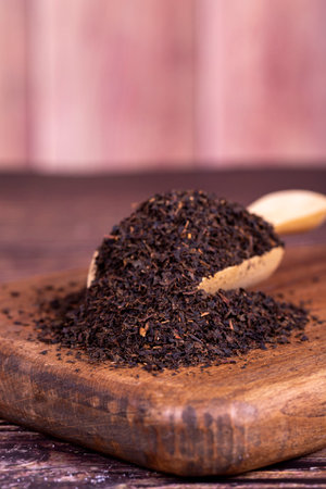 Turkish black tea. Black tea in spoon on wood background. close upの写真素材