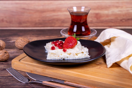 GÃ¼llaÃ§ dessert with pomegranate and strawberry. Ramadan dessert. Gullac dessert with walnuts...