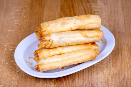 pacanga pastry Pacanga boregi made with bacon, cheddar and pepper in a ceramic bowl. close up