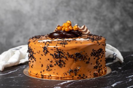 Caramel cream cake. birthday or celebration. Pistachio, chocolate, caramel and cream cakeの写真素材