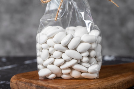 Packed Almond Candy. Snack chocolate covered marzipan on dark background. local name almond sugar. close upの写真素材