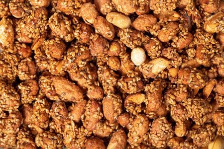 Honey with sesame peanuts. Peanuts with sesame closeup food background. Top view. texture. copy space bannerの写真素材
