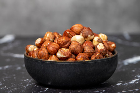 hazelnut Peeled hazelnuts in bowl. superfood. Vegetarian food concept. healthy snacksの写真素材