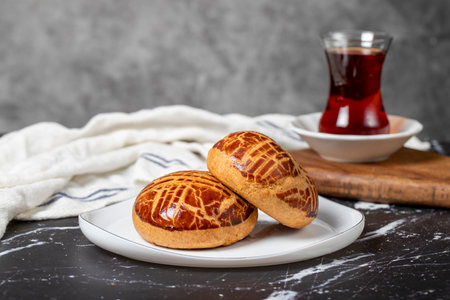 Pastry on dark background. Local name plain pogaca