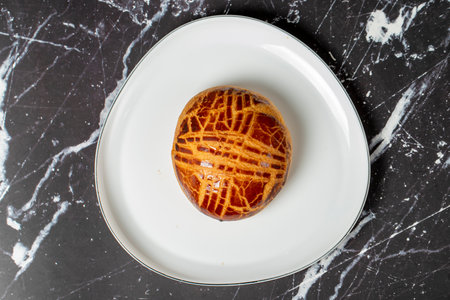 Pastry on dark background. Local name plain pogaca. Top viewの写真素材