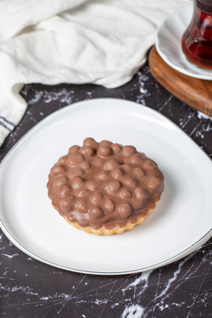 Chocolate pie. Hazelnut, cream and chocolate pie on dark backgroundの写真素材