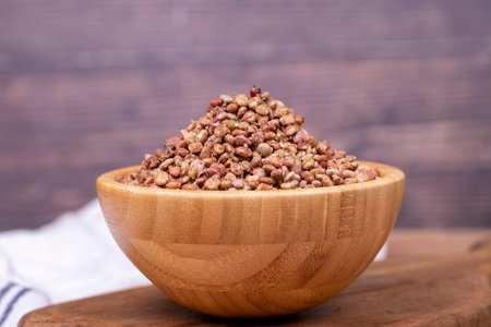 Sumac seeds. Dried sumac berries on wooden background. Spice concept. close upの写真素材