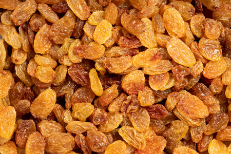 Raisins. Sun-dried yellow grapes closeup food background. Top view. texture. copy space bannerの写真素材