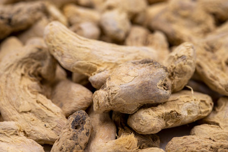 Pile of Dried Ginger root as background, spice or seasoning as background. Close-up ginger root or Dry Adrakの写真素材