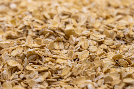 Pile of oatmeal or oat flakes as background. Close-up oatmealの写真素材