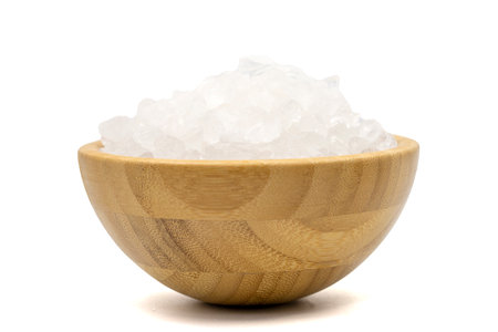 Lemon salt or Citric acid isolated on white background. Citric acid or lemon salt in wooden bowlの写真素材