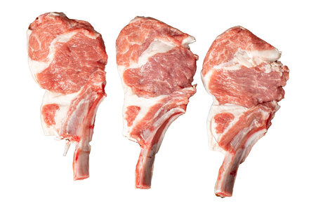Raw lamb chops isolated on white background. Fresh raw lamb chops with spices and herbs. Top viewの写真素材
