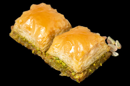 Pistachio baklava isolated on white background. Turkish cuisine delicacies. Turkish baklava. close upの写真素材
