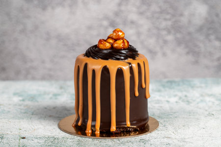 Chocolate cake on gray background. Cream and chocolate cakeの写真素材