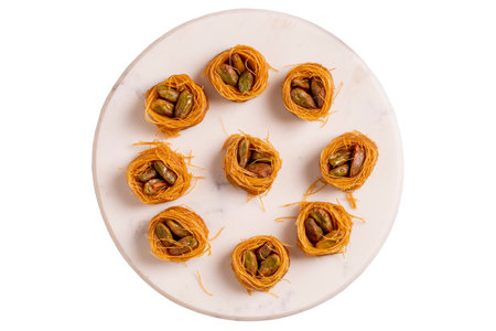 Bulbul Kadayif with Pistachio. Kadayif baklava with pistachio filling isolated on white background. Turkish cuisine desserts. close-up. local name Bulbul Kadayif with Pistachioの写真素材