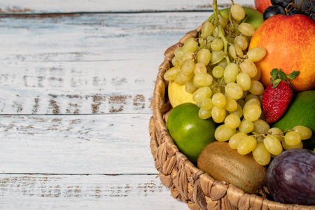 Fresh fruits in a wicker basket. Various colorful fruits. Copy spaceの写真素材