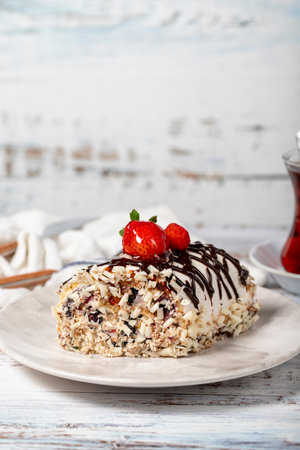 Strawberry log cake. Strawberries and cream cake on a white background. Close up