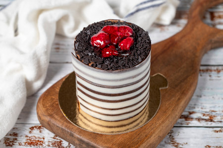 Raspberry cake. Delicious chocolate covered cake on a white background. Close up