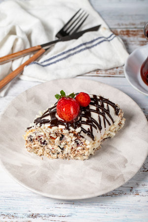 Strawberry log cake. Strawberries and cream cake on a white background.