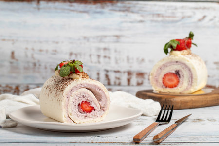 Strawberry cake. Strawberry roll cake on a white backgroundの写真素材