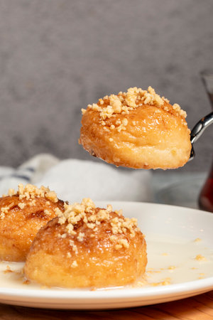 Kemalpasa dessert. Milky dessert. Dessert with hazelnuts, milk and sherbet. Close upの写真素材