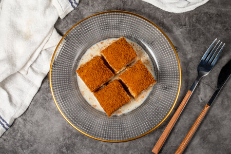 Cold baklava with biscuits. Cold baklava with biscuit filling on a dark background. local name cold...