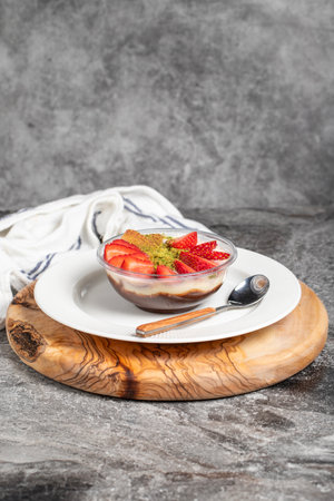 Strawberry magnolia dessert. Strawberry pudding dessert on wooden serving board. Famous dishes of Turkish cuisineの写真素材