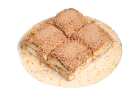 Cold baklava with pistachios isolated on white background. Turkish cuisine delicacies. Ramadan Dessert. local name cold baklavaの写真素材