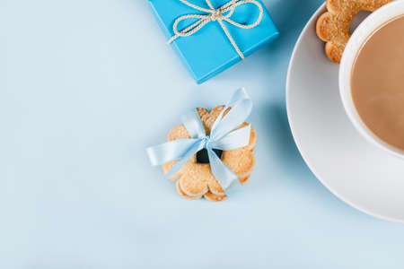 Coffee and cookies on blue background from the topの写真素材