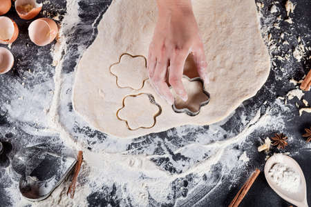 Making of cookies with ingredients like eggs, flour, cinnamon, anise, rolling pin, paper on...