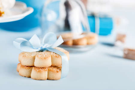Cookies with blue ribbon on blue backgroundの写真素材