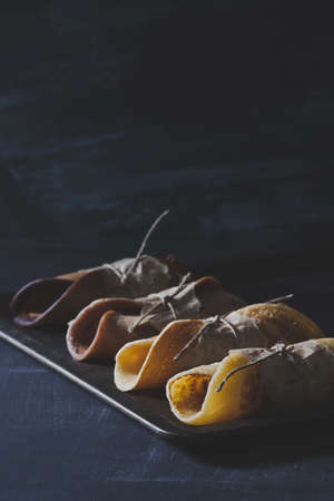 Rustic breakfast with chocolate pancakes on blackboardの写真素材