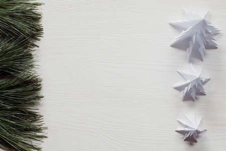 Origami christmas trees with pine on the sideの写真素材