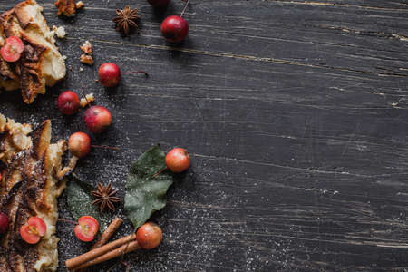 Rustic pie with small apples, cinnamon, anise and pineの写真素材