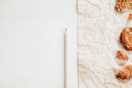 Gluten free cookies on the vintage white wood with paper and pencilの写真素材