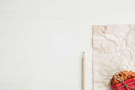 Vegan cookie in red paper on white wooden tableの写真素材