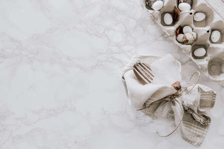 Natural Easter decoration with willow and egg box on marble table topの写真素材
