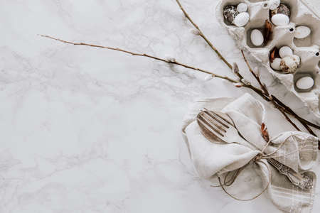 Easter decoration with natural materials like eggs and willow on marble table topの写真素材