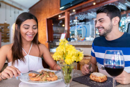 Romantic Couple Have Italian Food Seafood Lunch Togetherの写真素材