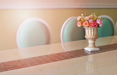 vintage flower pot / Seramic vase of flowers in pot classic style on the dinner tableの写真素材