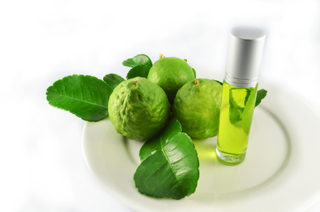 Kaffir lime extract oil on White background / bergamot essential oil Thai herbs medicinal properties used to make oil extracts Kaffirの写真素材