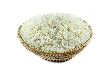 raw rice isolated / white rice in basket isolated on white backgroundの写真素材