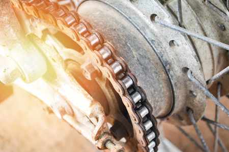 motorcycle chain / close up of old rear chains in wheel motorcycle and sprocketの写真素材