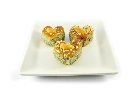 mini cookies isolated / heart shaped of cookies cake with white sesame and  cashew nut on top isolated on white backgroundの写真素材