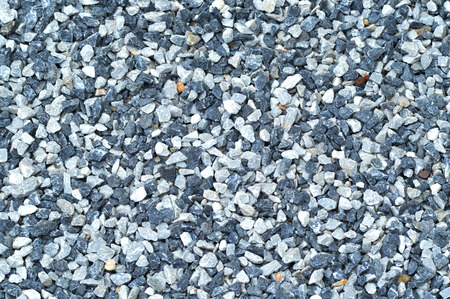 granite gravel of macadam / ground texture with scree background / small stones rock gray and blue on floorの写真素材