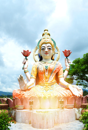 Guan Yin statue / colorful of statue Guan Yin on the rock outdoors at temple in thailandの写真素材
