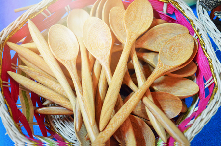many wooden spoons in the basketの写真素材