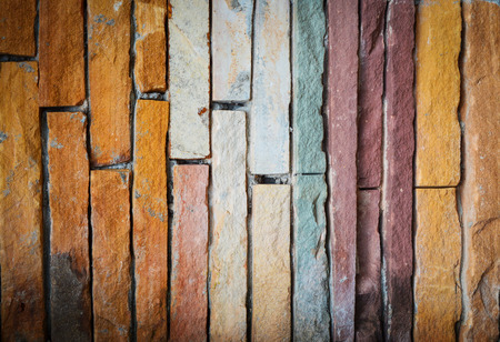 old wall colorful stone bricks texture /  colorful tile cement vintage wall backgroundの写真素材