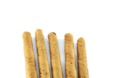 wafer rolls chocolate crispy cream filled wafer sticks  isolated on white backgroundの写真素材